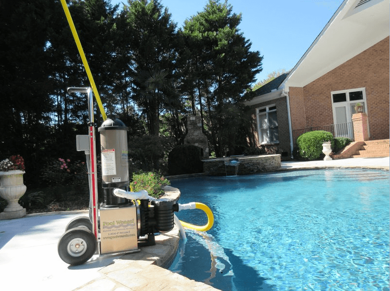 Backyard residential pool with the Pool Weasel system in use